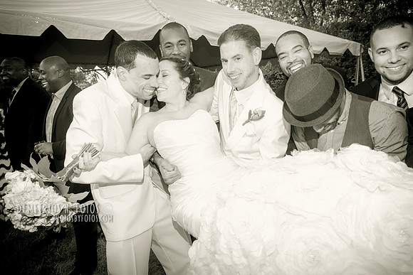 bride picked up by groomsmen