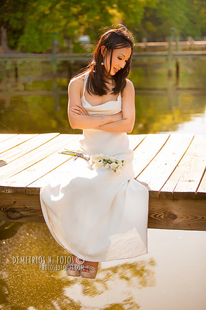 Bride sitting on pier